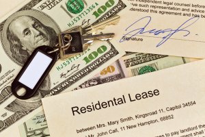 Cash with keys and residential lease papers