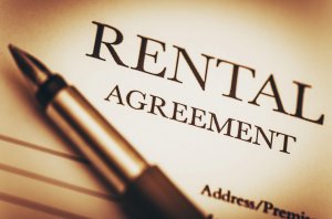 Rental agreement paperwork with pen