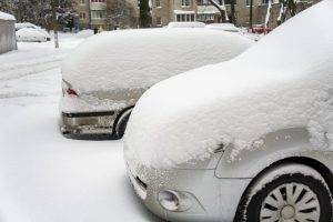 Cars covered in snow